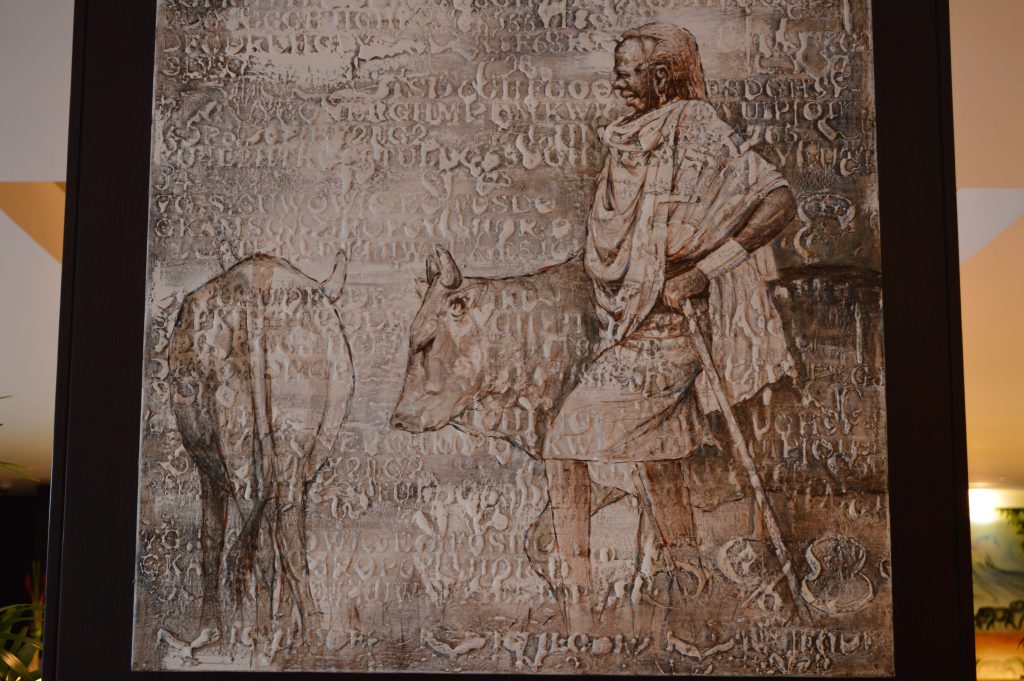 Pintura de un guerrero masai con su ganado